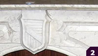 Carrera marble mantel with shield medallion