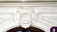 Parlor style white marble mantel with shell medallion