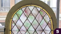 Arched pink and green stained glass